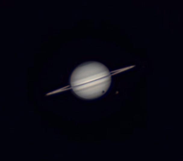 Solar eclipse produced by Titan over Saturn