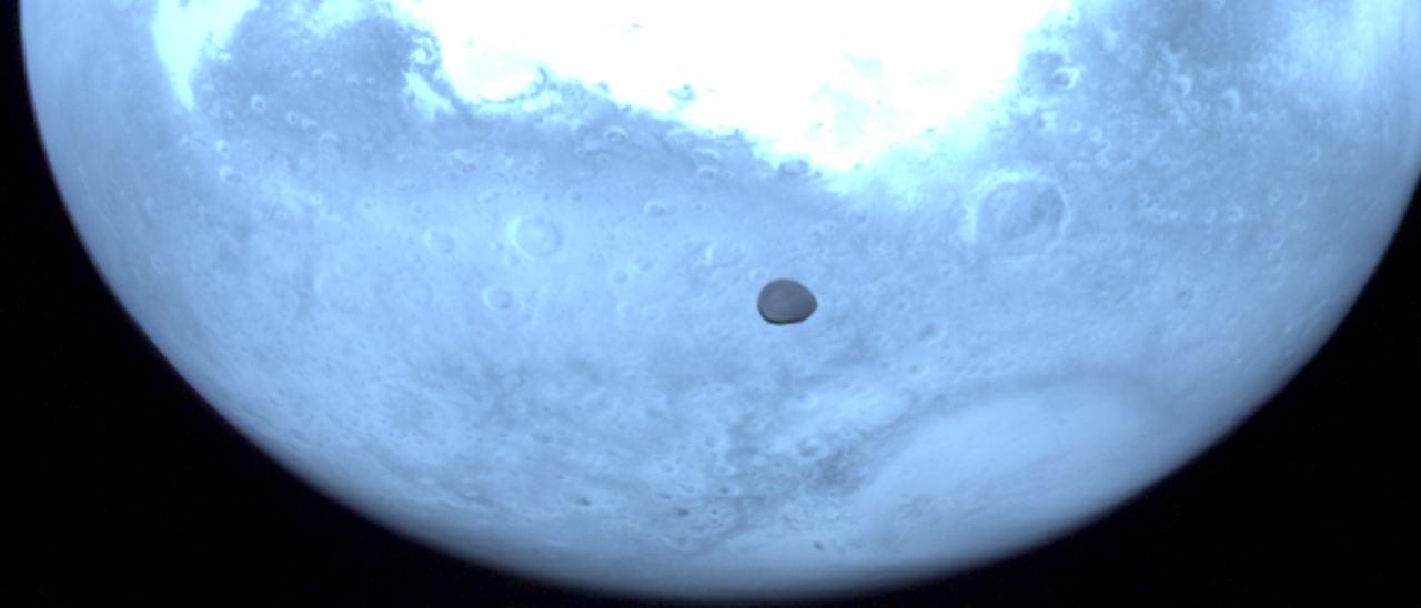 Image of Deimos with Mars on the background, obtained with the HyperScout-H instrument on board the Hera spacecraft 