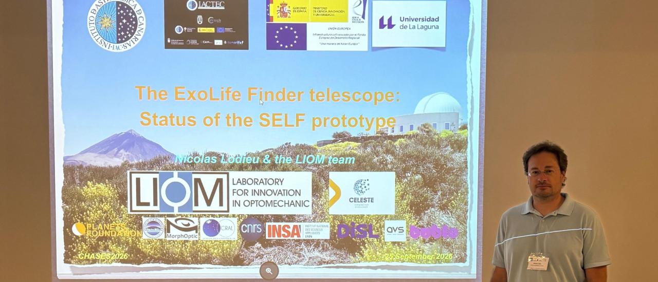 Nicolas Lodieu standing beside the screen during his presentation on the SELF telescope at the CHASES 2026 conference