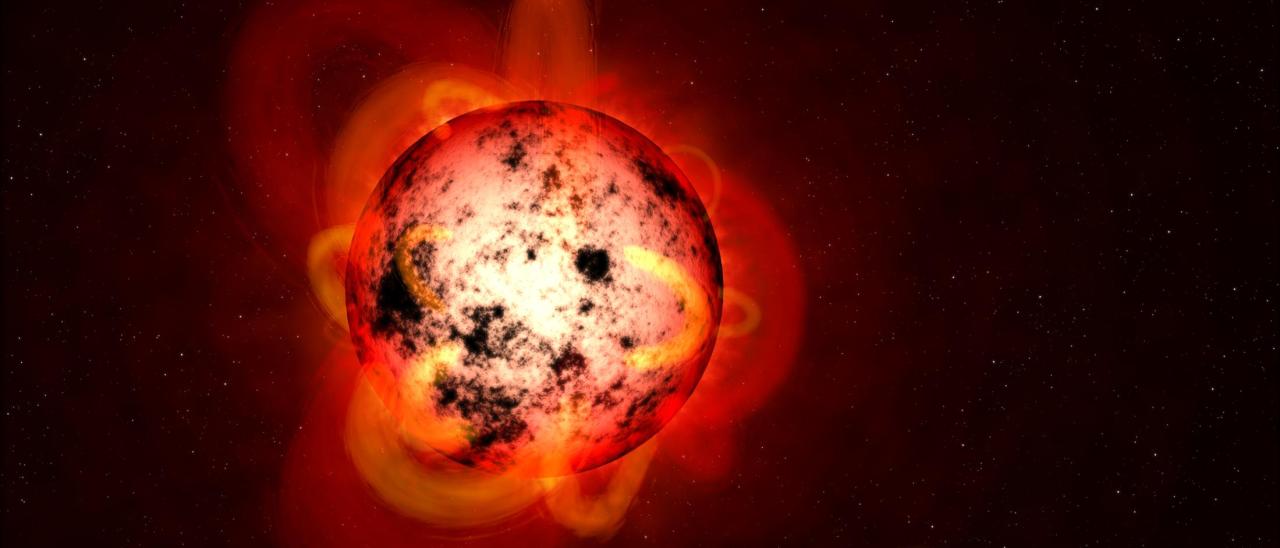 Ilustración de una estrella enana M cubierta de manchas estelares. NASA/ESA/STScI/G. Bacon.
