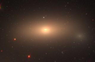 Color image of the Hubble Space Telescope (HST) of the massive relic galaxy NGC1277. The image was constructed using filters F475W, F625W and F850LP that cover the visible range of radiation. The data was obtained with the HST program GO-14215 (whose prin