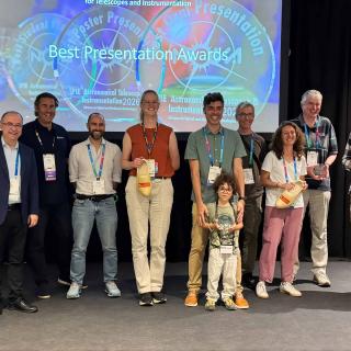 Elvio Hernández Suárez poses with other award recipients at SPIE Astronomical Telescopes + Instrumentation 2026.