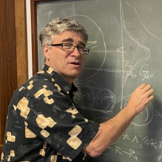 Jeffrey R. Kuhn, from University of Hawaii Jeffrey R. Kuhn, writing on a blackboard during his visit the IAC.
