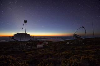 MAGIC Telescopes, at the Roque de los Muchachos Observatory (La Palma), at dusk. Credits: Daniel López / IAC. MAGIC Telescopes, at the Roque de los Muchachos Observatory (La Palma), at dusk. Credits: Daniel López / IAC.
